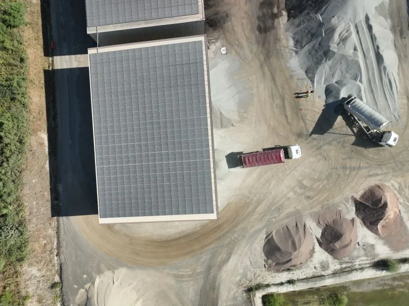 Aggregate stockpiles seen from the air during a drone survey used for volume calculation — Dronexperts